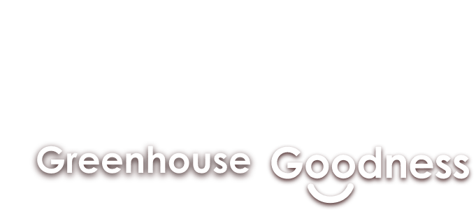 Text reading "falling for Greenhouse Goodness" with a smiley face under the "d" in "Goodness." The text has a mix of cursive and bold fonts. GREENHOUSE Goodness